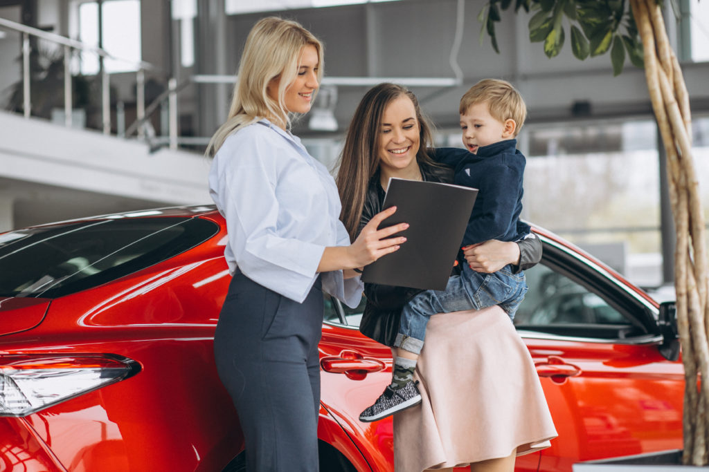 Mother with son buying a car Mother with son buying a car